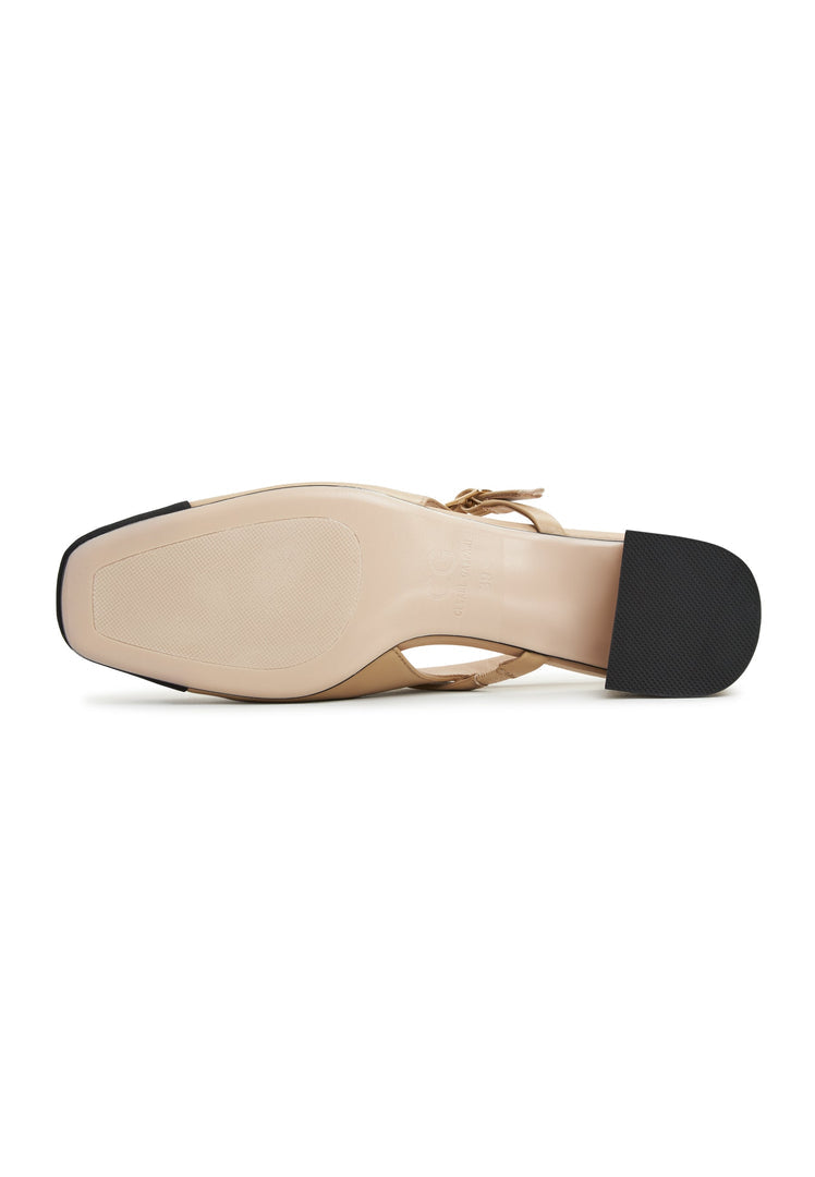 A stylish pair of Marisol beige slingback block heel pumps, perfect for adding a touch of elegance to any outfit.