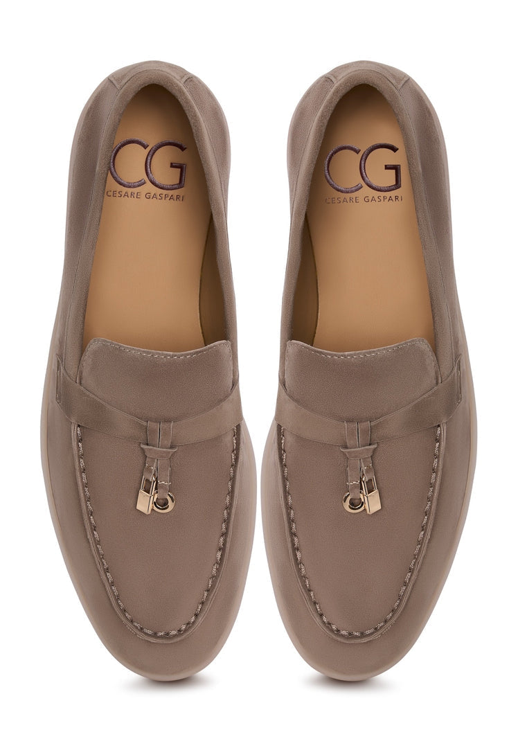 A stylish pair of Aurelia platform moccasins in dark beige, perfect for women seeking fashionable comfort and height.