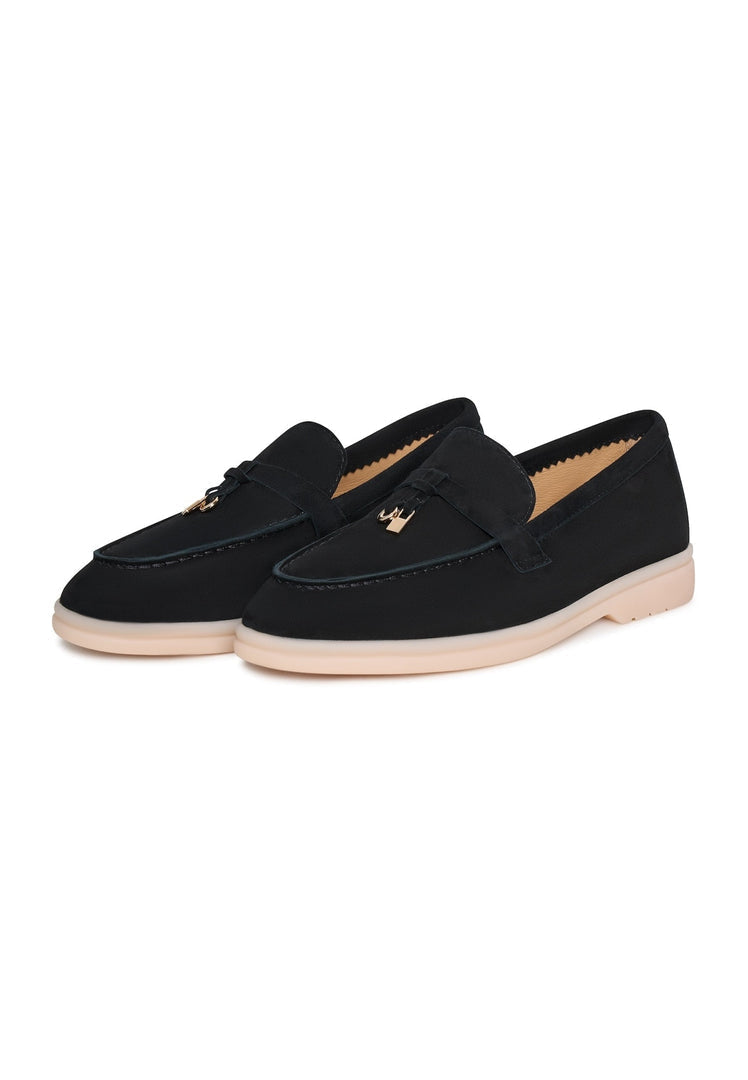 A pair of stylish black platform moccasins, known as Aurelia moccasins, ideal for women looking for chic black leather shoes with a trendy twist.