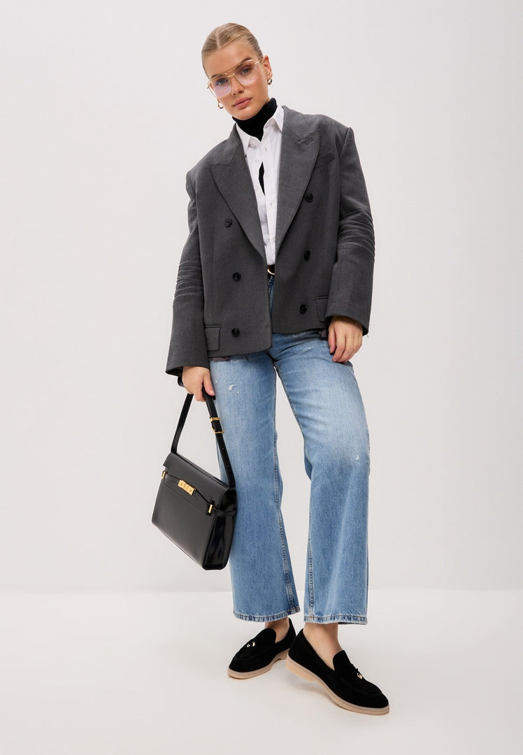 A pair of black platform moccasins, known as Aurelia moccasins, made of luxurious black leather, perfect for women looking for stylish black footwear.