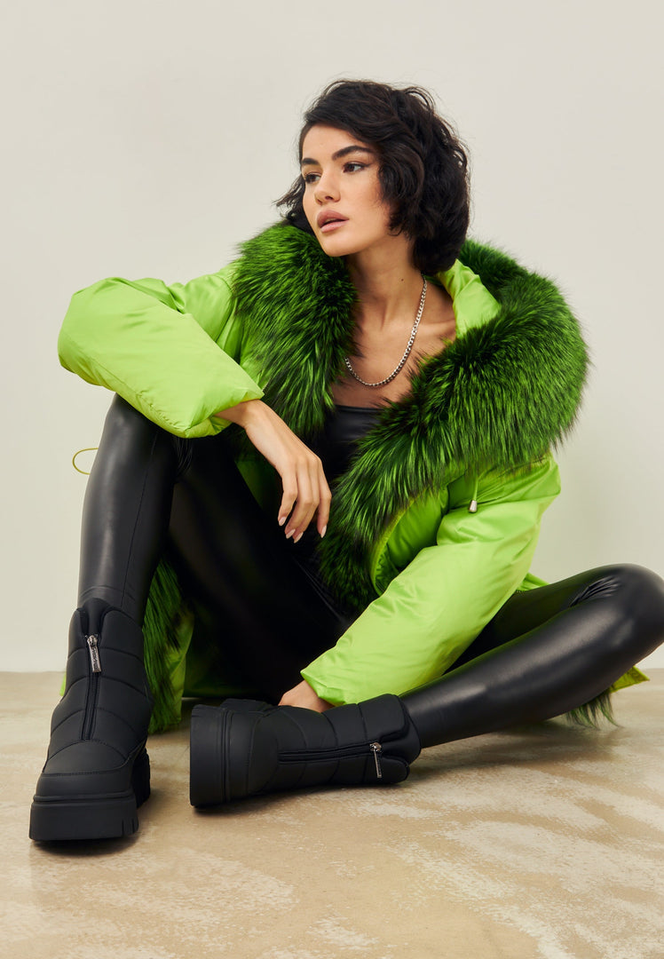 A pair of stylish black snow boots, perfect for winter weather with an elegant and fashionable design.