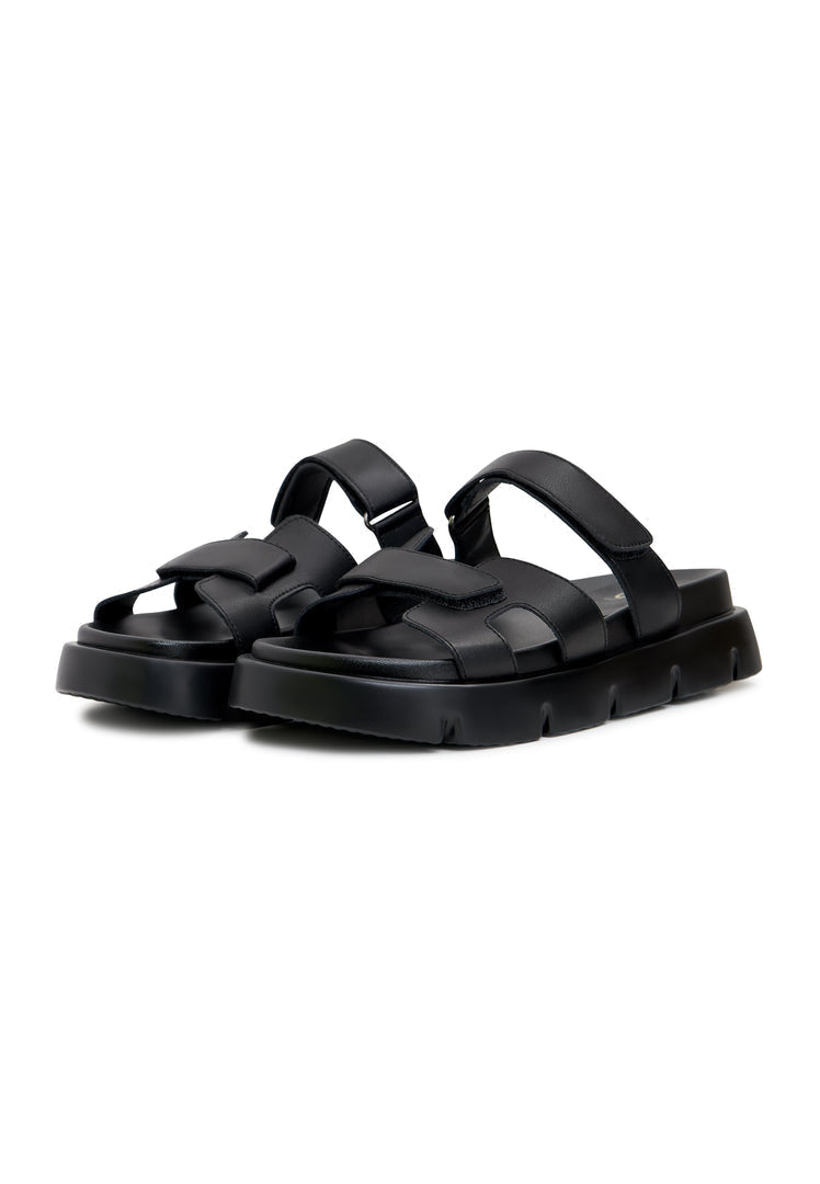 A stylish pair of black Kati platform mules, perfect for a trendy and chic look.