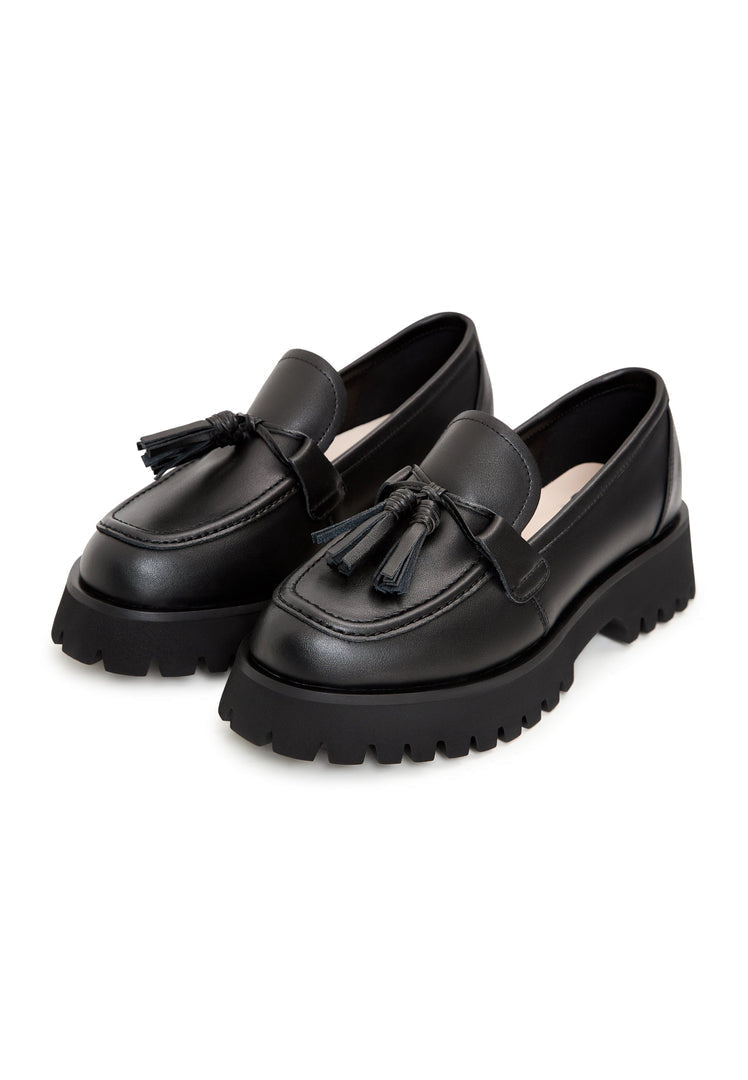 A stylish pair of black platform loafers with a chunky sole, known as Ksenia platform loafers, perfect for women looking for casual yet trendy footwear.