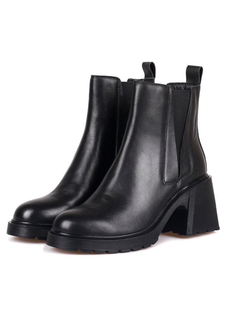 A stylish pair of women's ankle boots, featuring a casual yet classic design - perfect for the trendy fashionista.