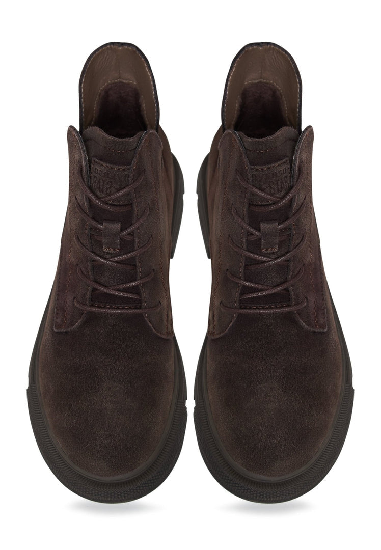 A pair of stylish and comfortable flat sole ankle boots, perfect for a casual and trendy look.