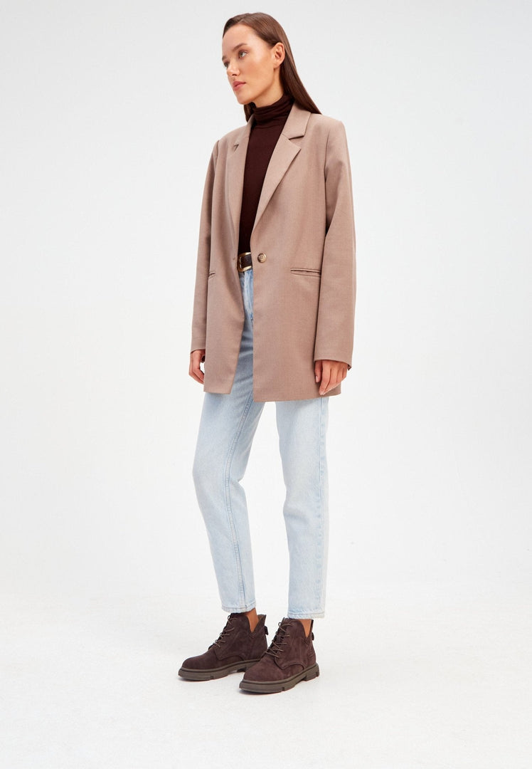 A pair of stylish and comfortable flat sole ankle boots, perfect for casual and trendy outfits.