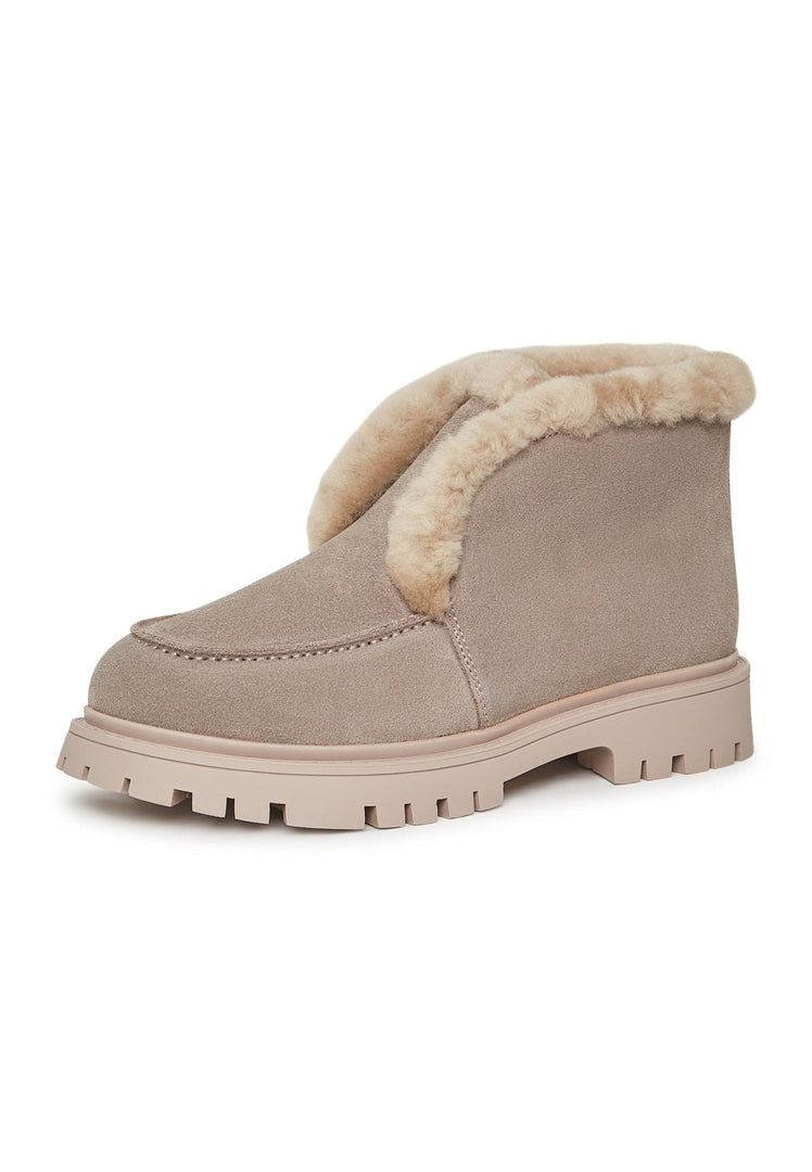 A pair of stylish women's suede ankle winter boots, perfect for the cold season.