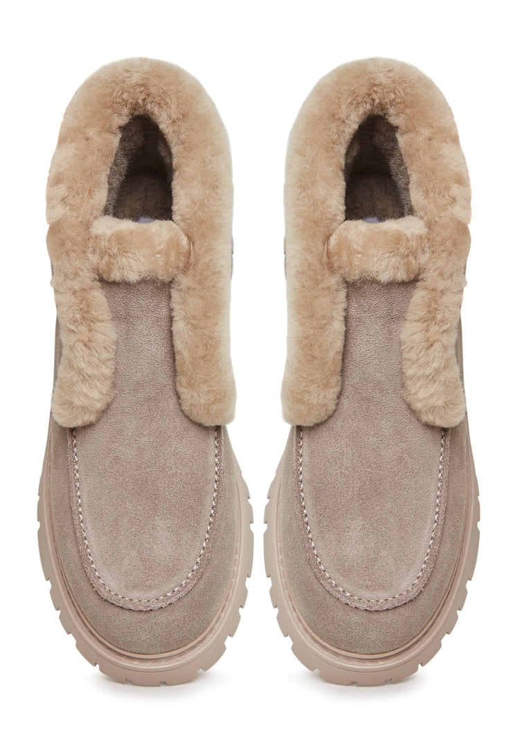 A stylish pair of women's suede ankle winter boots perfect for the cold season.