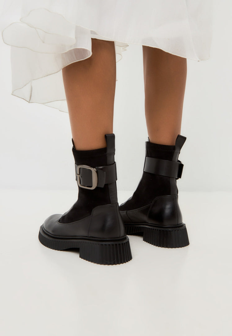 A stylish pair of black Ciara ankle boots with a chunky sole, perfect for a trendy and fashionable look.