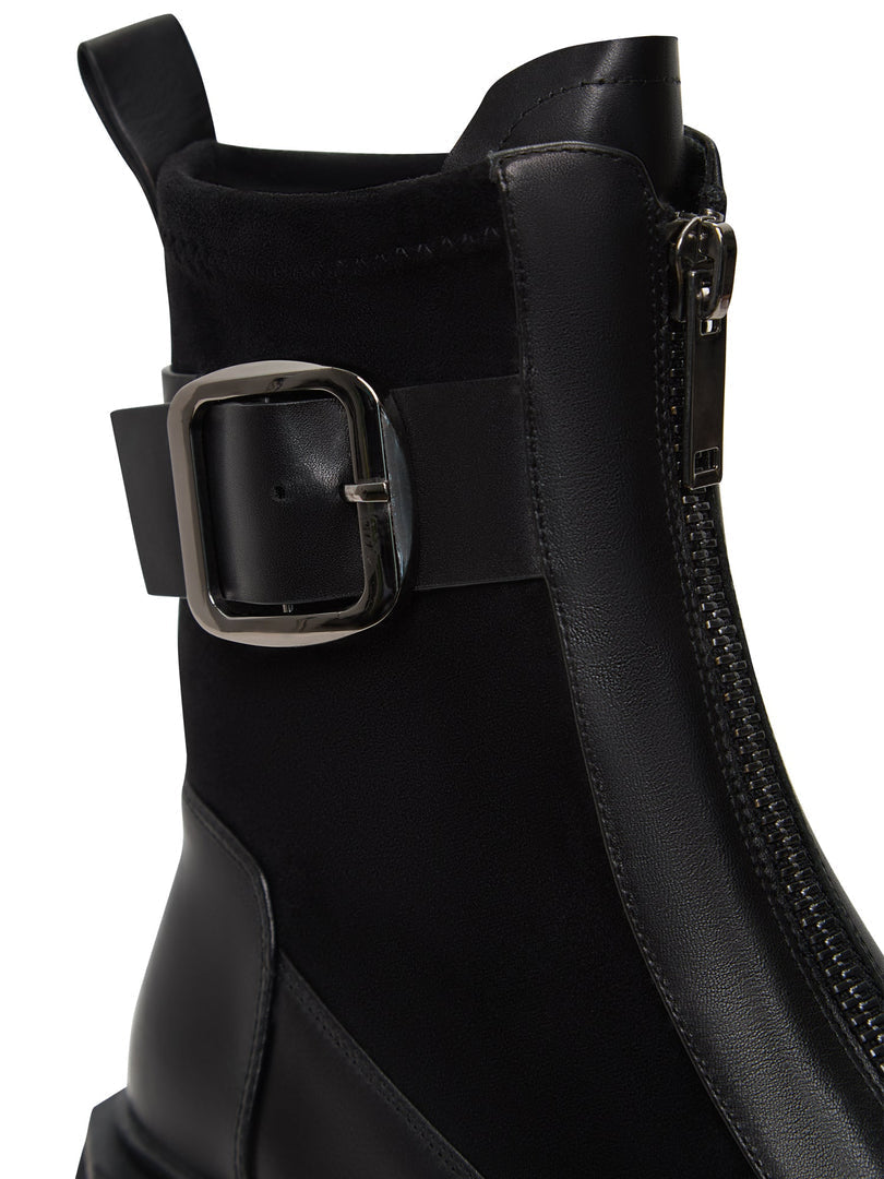 A trendy pair of black Ciara ankle boots with chunky soles, perfect for anyone looking for stylish and edgy footwear.