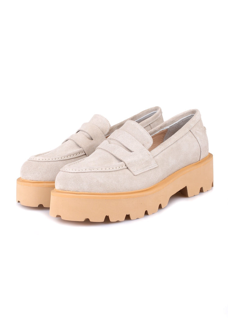 A sleek pair of beige suede slip-on loafers for men, the epitome of stylish and comfortable footwear.