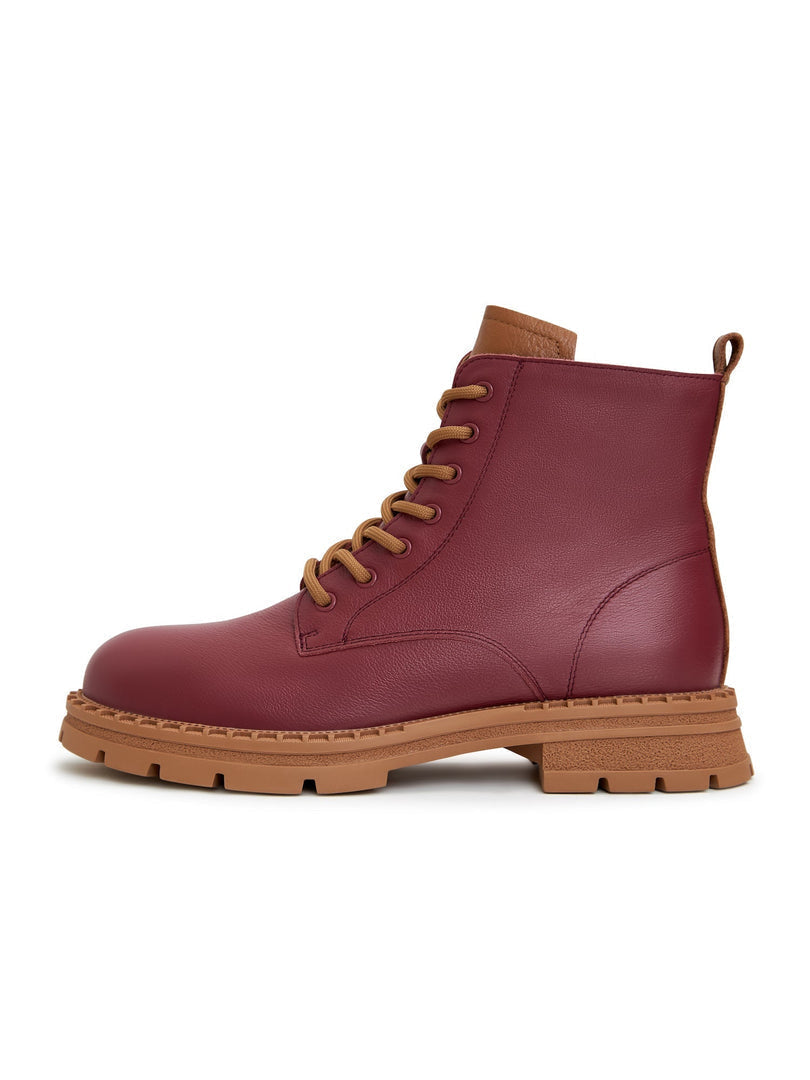 A stylish pair of women's leather lace-up ankle boots in Bordeaux color, perfect for adding a touch of fashion to any outfit.