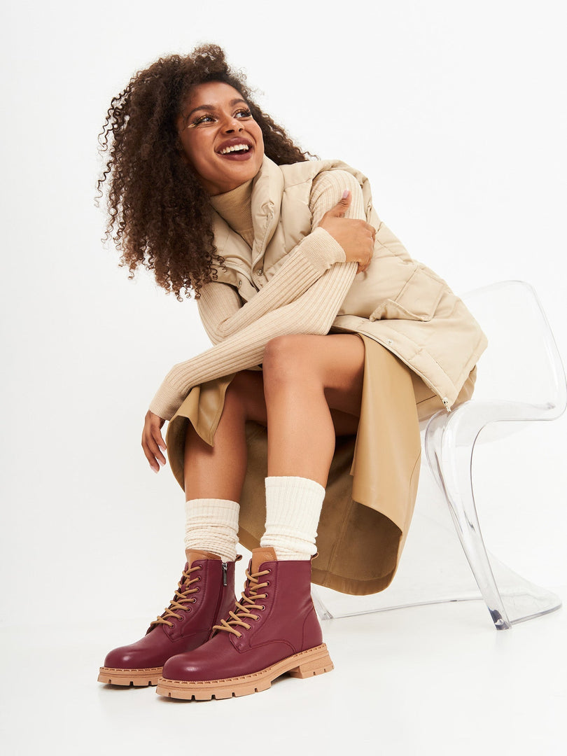 A stylish pair of women's leather ankle lace-up boots in a rich Bordeaux color, perfect for adding a fashionable touch to your footwear collection.