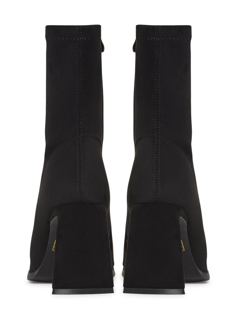 A pair of chic black suede ankle boots with a trendy block heel, perfect for casual wear.