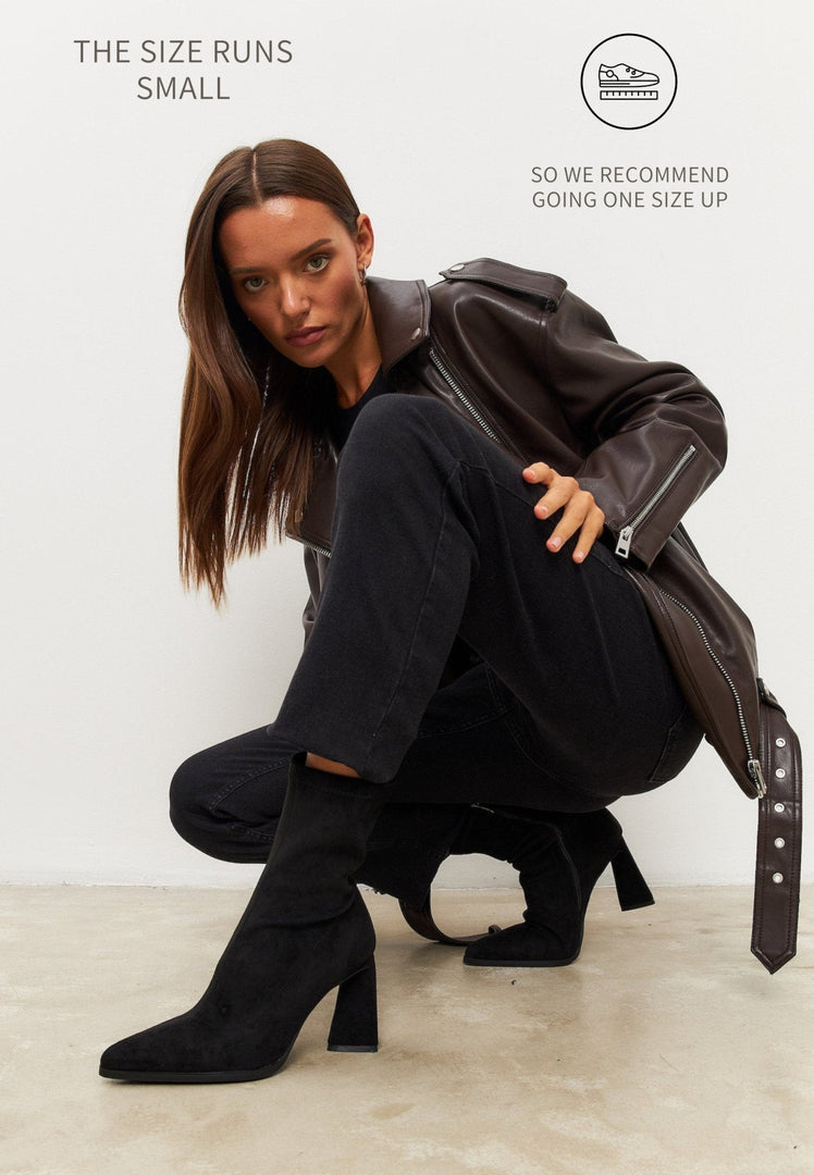 A stylish pair of black ankle suede boots with a block heel, ideal for casual wear.