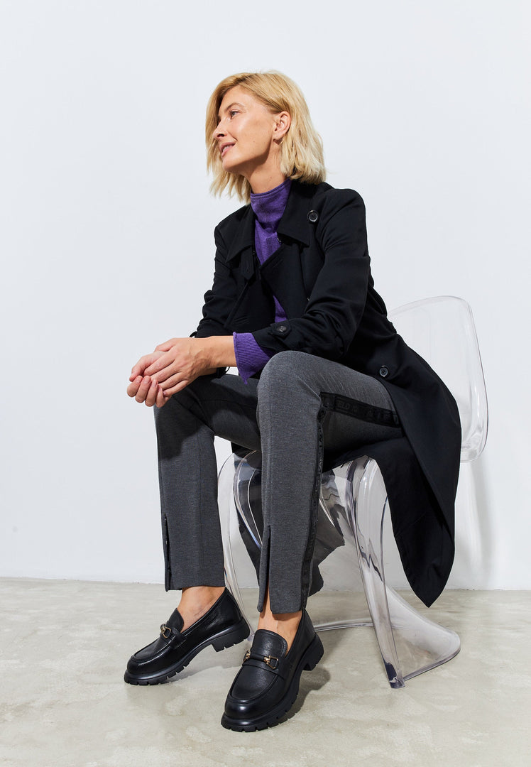 A stylish pair of black leather platform loafers, perfect for women looking for trendy and comfortable slip-on shoes.