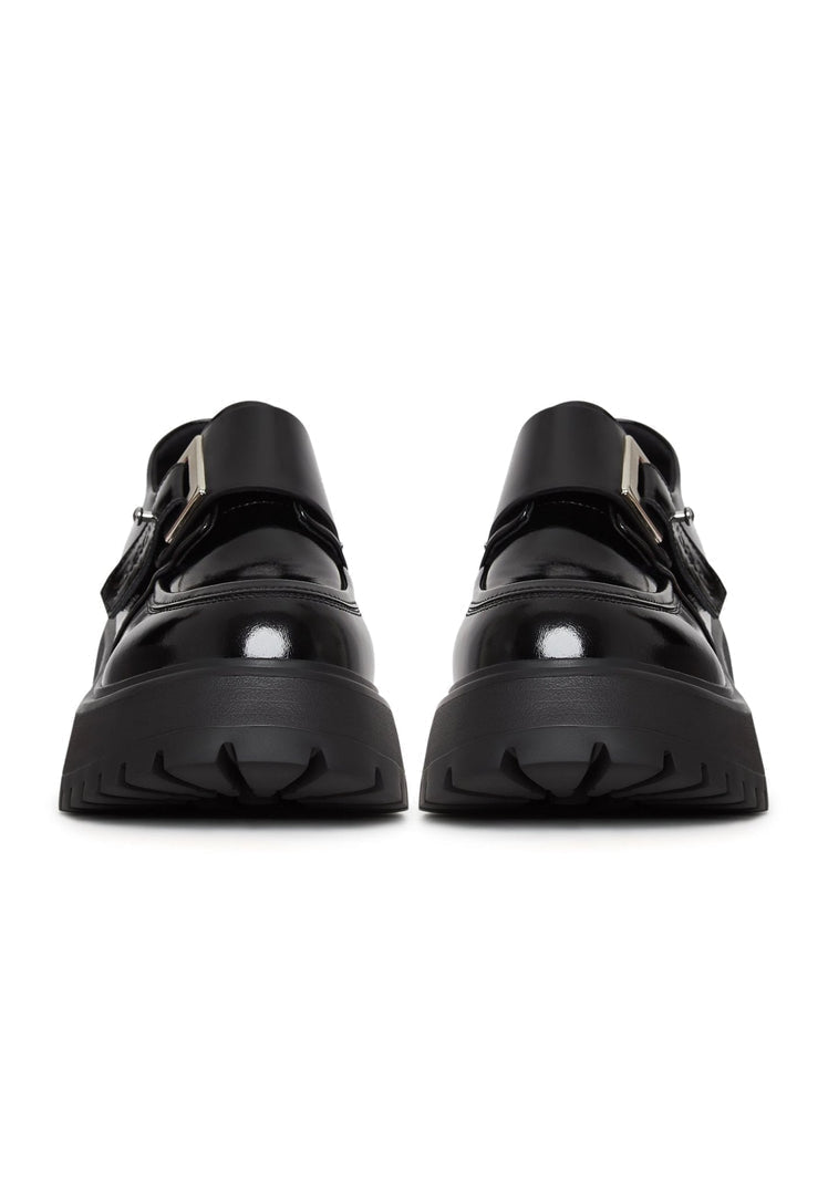 A stylish pair of unisex black leather loafers, perfect for men and women looking for fashionable and comfortable leather slip-on shoes.