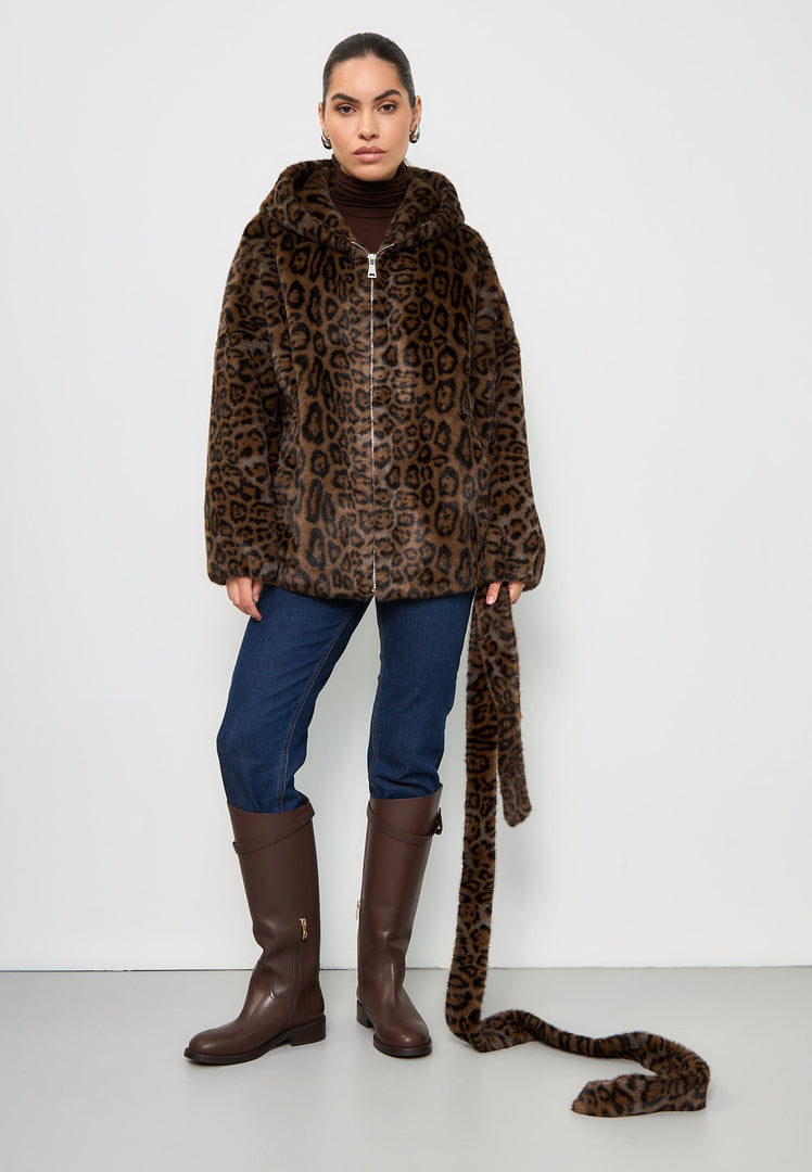 A trendy women's faux fur jacket with a hooded leopard design known as the Reyna leopard jacket, perfect for chilly weather and stylish outings.