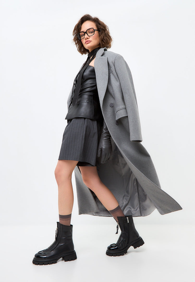 A trendy pair of chunky black Jaq ankle boots with a stylish zipper detail.