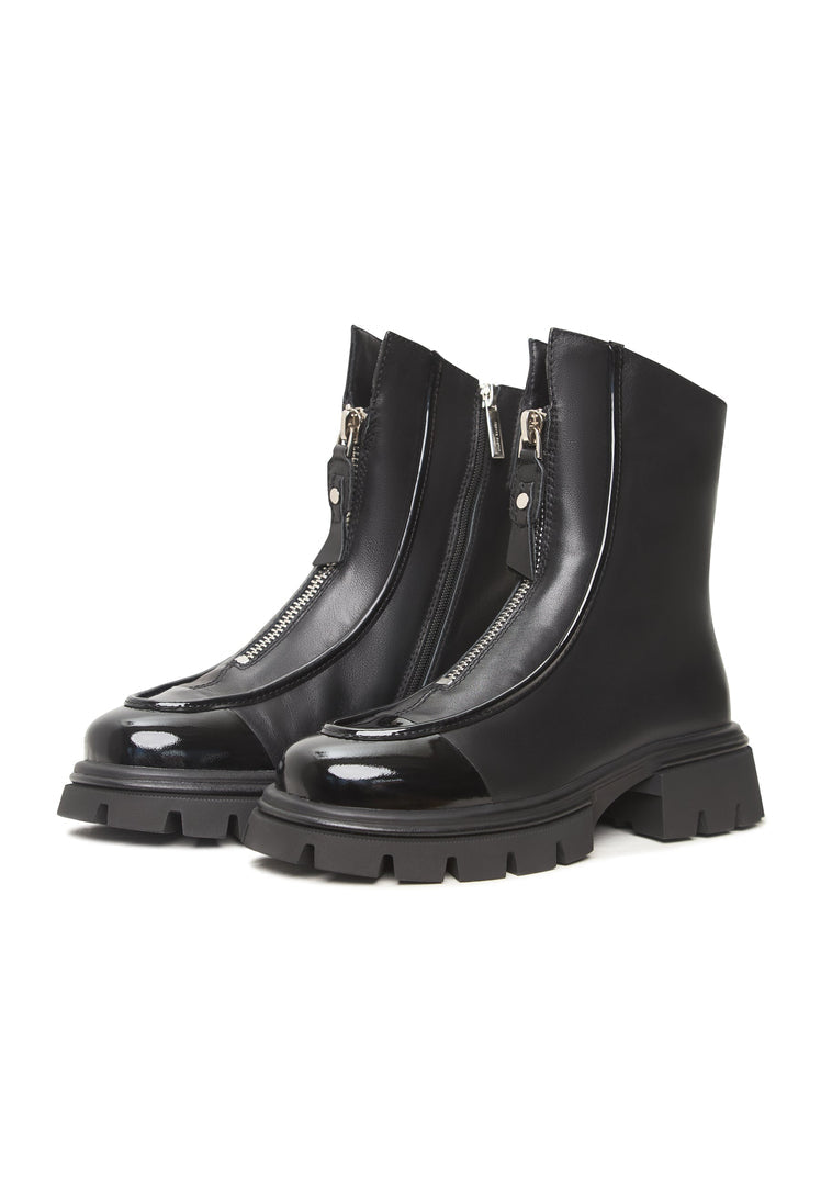 A stylish pair of black chunky zipper ankle boots with a trendy design perfect for any outfit, like the Jaq ankle boots.