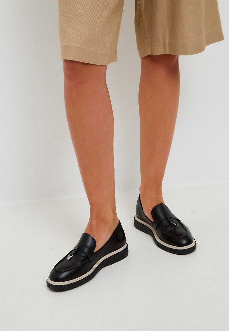 A stylish pair of black leather slip-on loafers for men, perfect for any occasion.