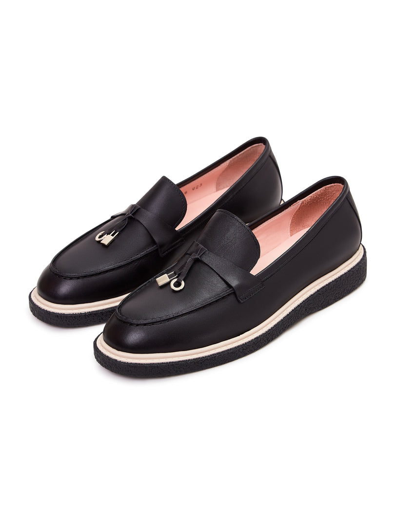 A stylish pair of black leather slip-on loafers for men, perfect for a casual yet refined look.