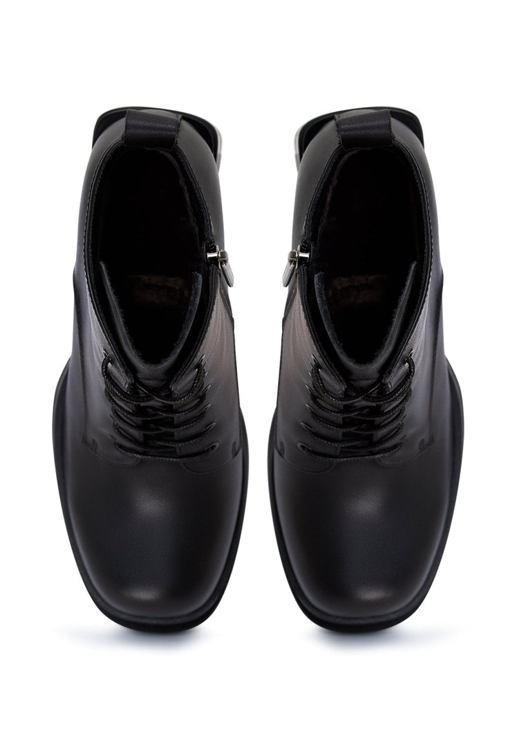 A stylish pair of black leather ankle boots with a trendy block heel for a chic and comfortable look.