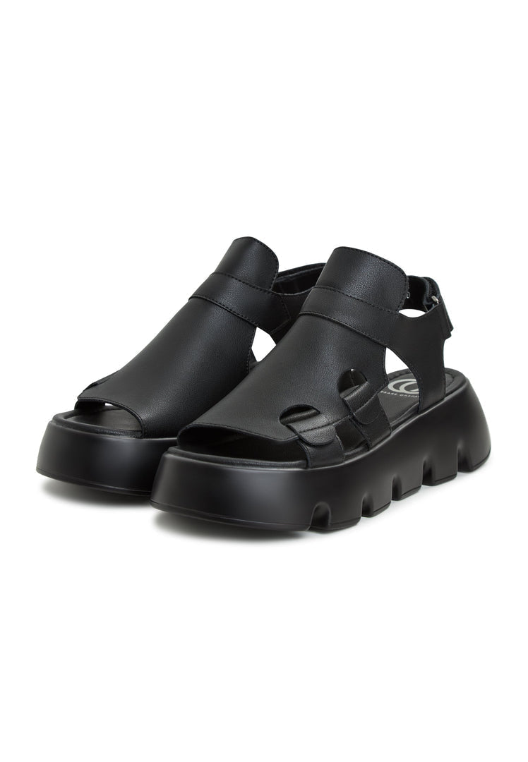Chic and contemporary, these Platform Sandals Amelie Black feature a sleek open-toe design with a bold elevated sole, perfect for adding height and style to any outfit.