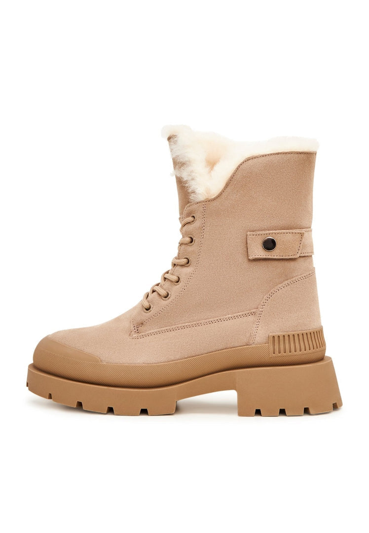 A pair of stylish beige suede ankle boots, perfect for adding an elegant touch to your outfit.