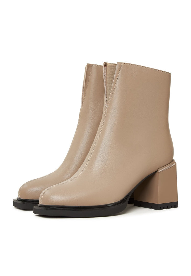 A stylish pair of women's casual high heeled ankle boots in beige, perfect for adding a touch of fashion to any outfit.