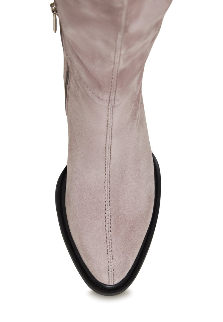 A pair of beige block heel women's boots, a classic choice for footwear fashion.