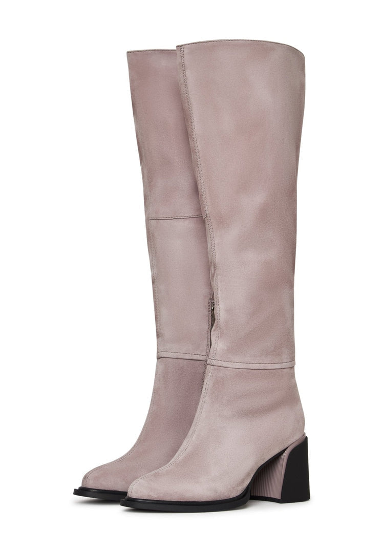 A stylish pair of women's block heel beige boots - classic footwear fashion essential.