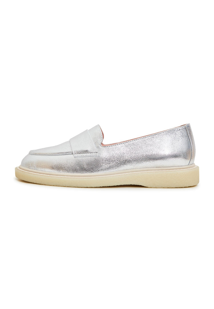 A pair of stylish silver women's loafers with a flat sole, perfect slip-on shoes for any casual or formal outfit.