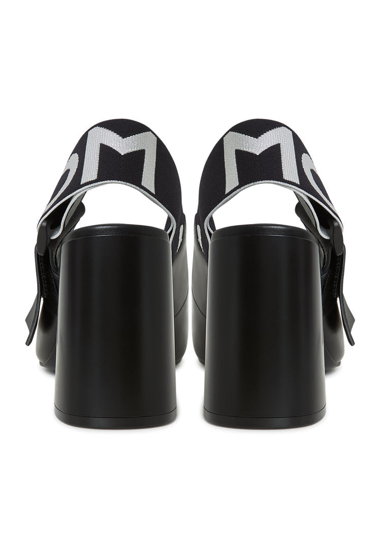 A trendy pair of black Jimena block heeled slingback pumps, the perfect addition to any women's footwear collection.