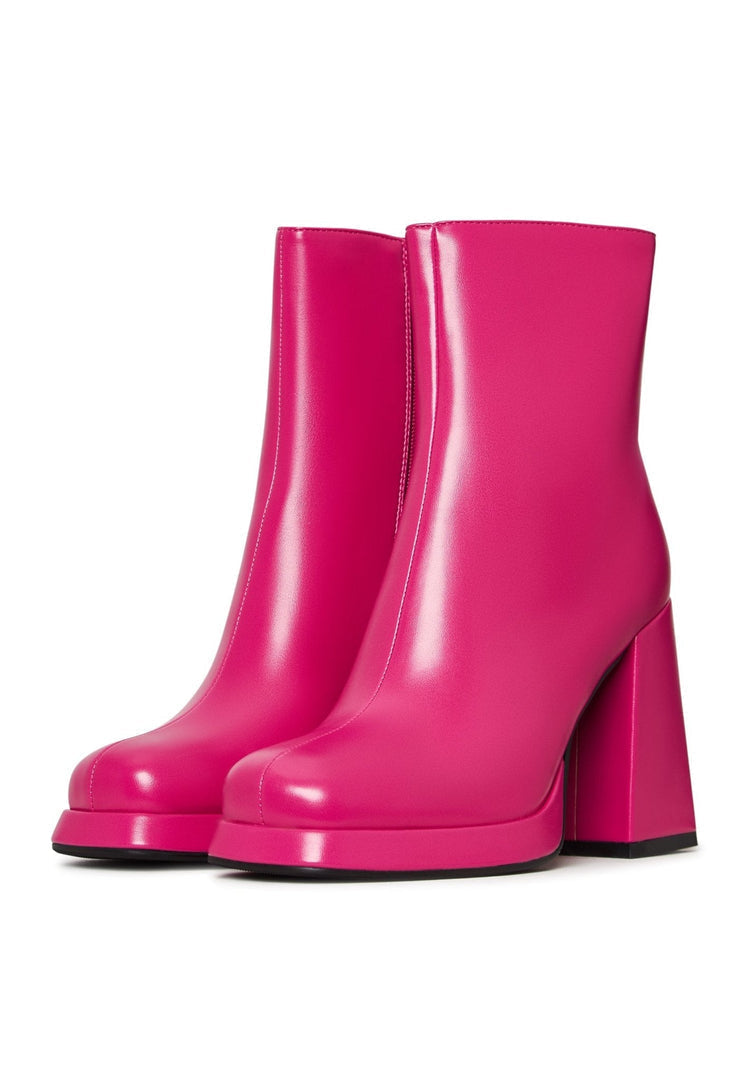 A pair of stylish pink ankle boots, perfect for women looking for comfortable and fashionable footwear.