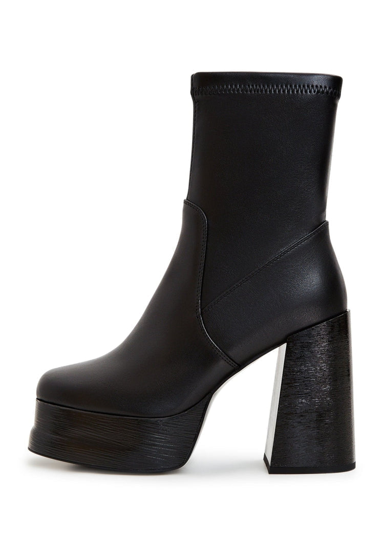 A stylish pair of black leather ankle boots with a high heel, perfect for women's fashion.