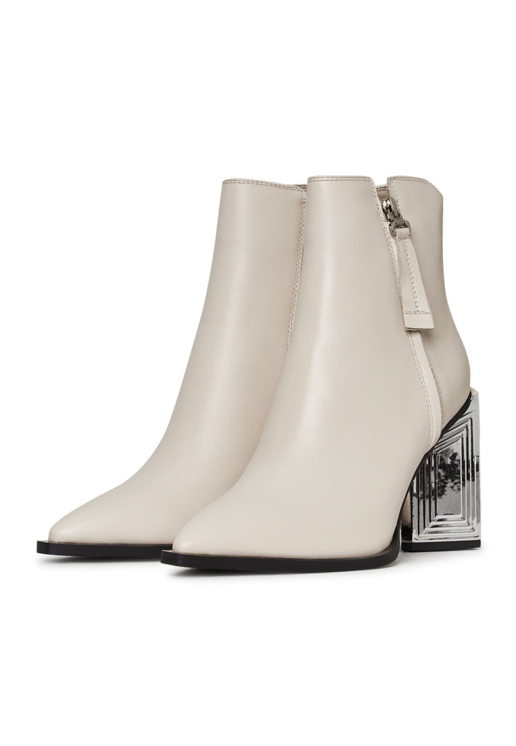 A stylish pair of leather ankle boots - classic beige women's footwear that combines fashion and sophistication, perfect for any occasion.