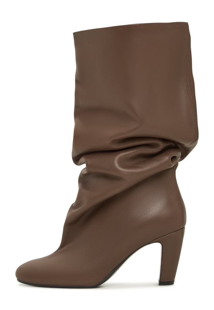A pair of chic brown Ada boots, slouchy mid-calf women's fashion footwear, perfect for a trendy fall look.
