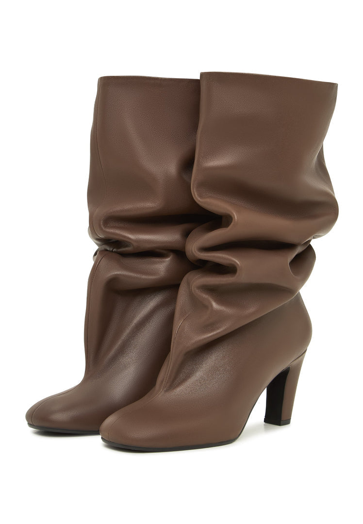 A pair of trendy fall boots in brown chic style, featuring slouchy mid-calf design known as Ada boots, perfect for women's fashion footwear.