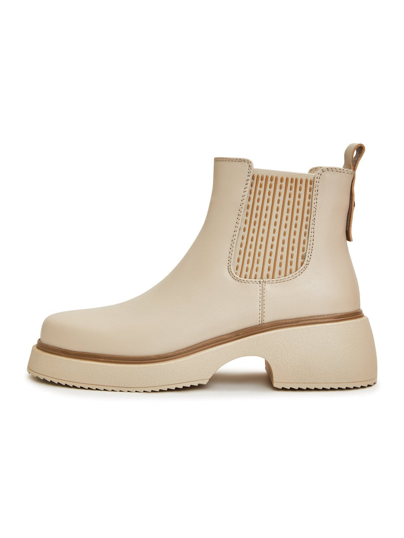 A stylish pair of women's leather ankle platform boots in beige, the perfect addition to your fashion footwear collection.