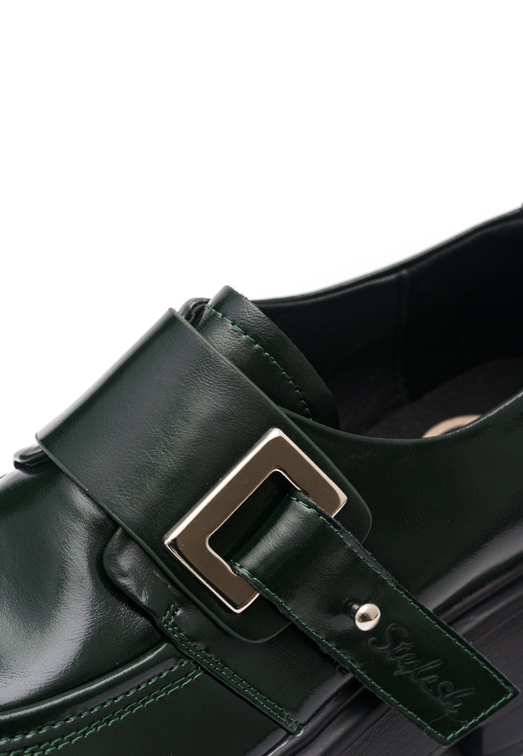 A stylish pair of premium green leather loafers, perfect for men or women looking for fashionable footwear.