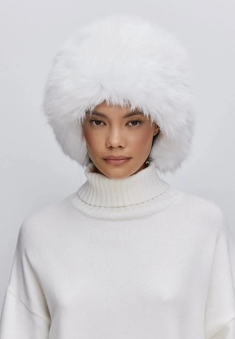 Stay warm and stylish with this white faux fur hat - buy the perfect winter accessory now!