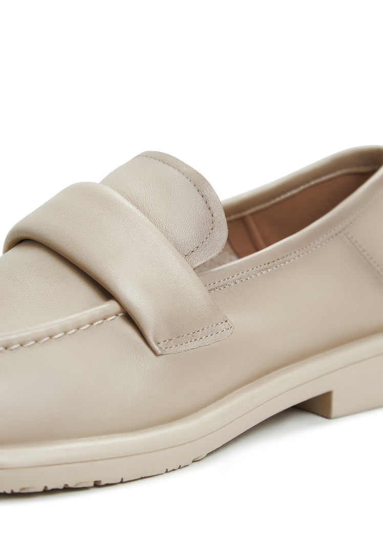 A pair of stylish beige block heeled loafers, known as Stephanie loafers, for women's fashion.