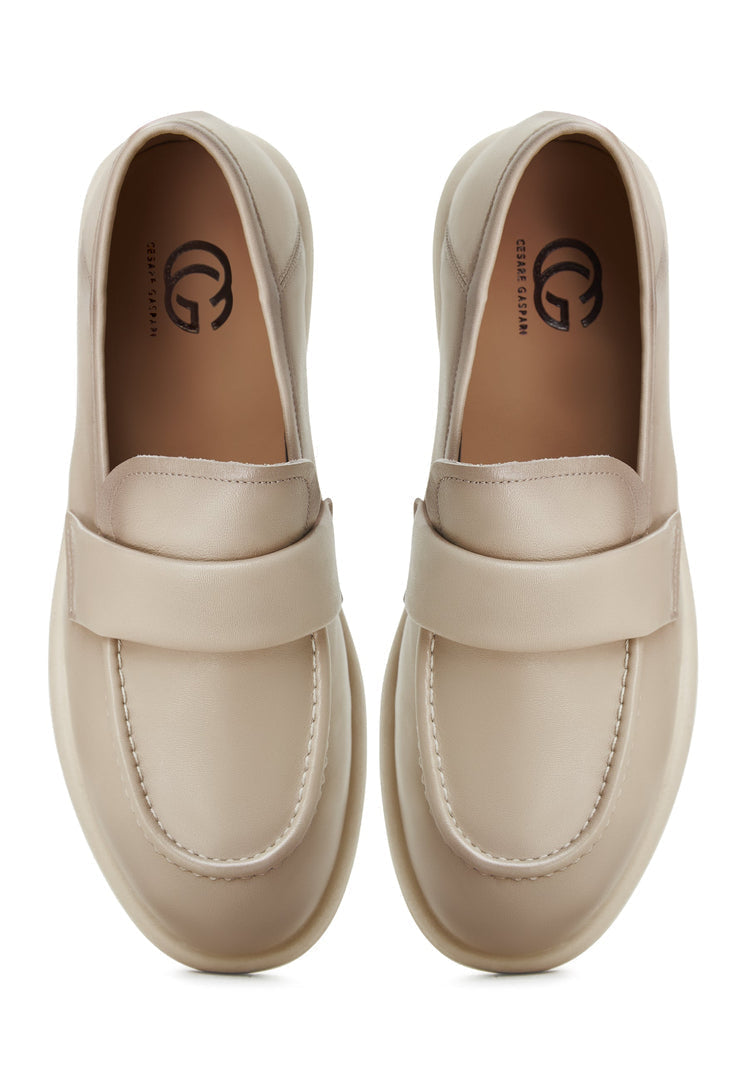A pair of beige Stephanie block heeled loafers, a chic and stylish option for women's fashion footwear.
