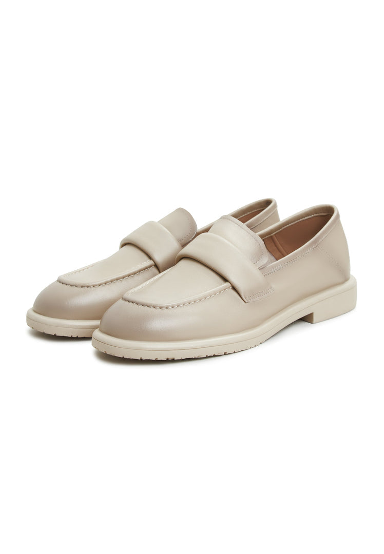 A stylish pair of beige block heeled loafers named Stephanie, perfect for women who love fashion-forward footwear.