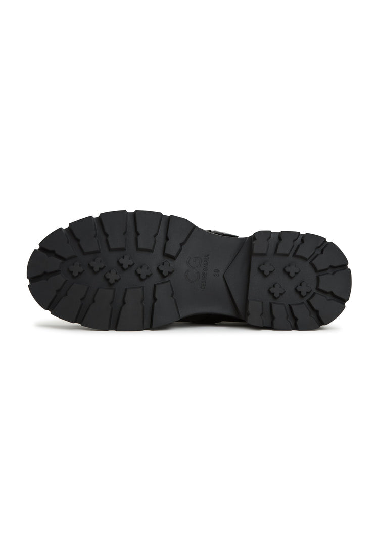 A stylish pair of women's leather platform loafers, also known as Marina loafers, featuring a slip-on design and a platform sole.