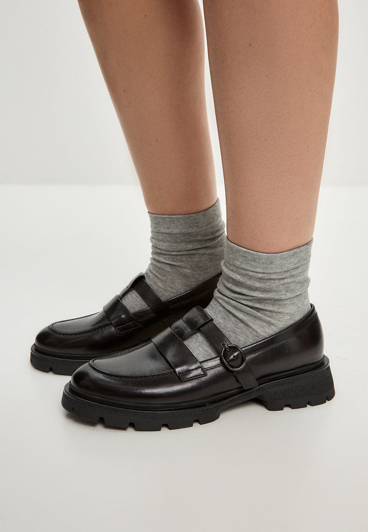 A stylish pair of women's leather platform loafers, known as Marina loafers, featuring a chic slip-on design.