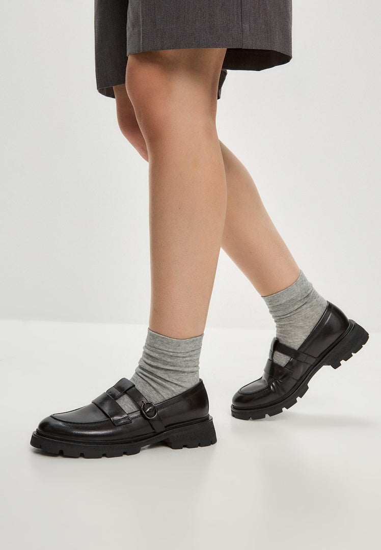 A chic pair of women's leather platform loafers, also known as Marina loafers, featuring a stylish design perfect for casual outfits.