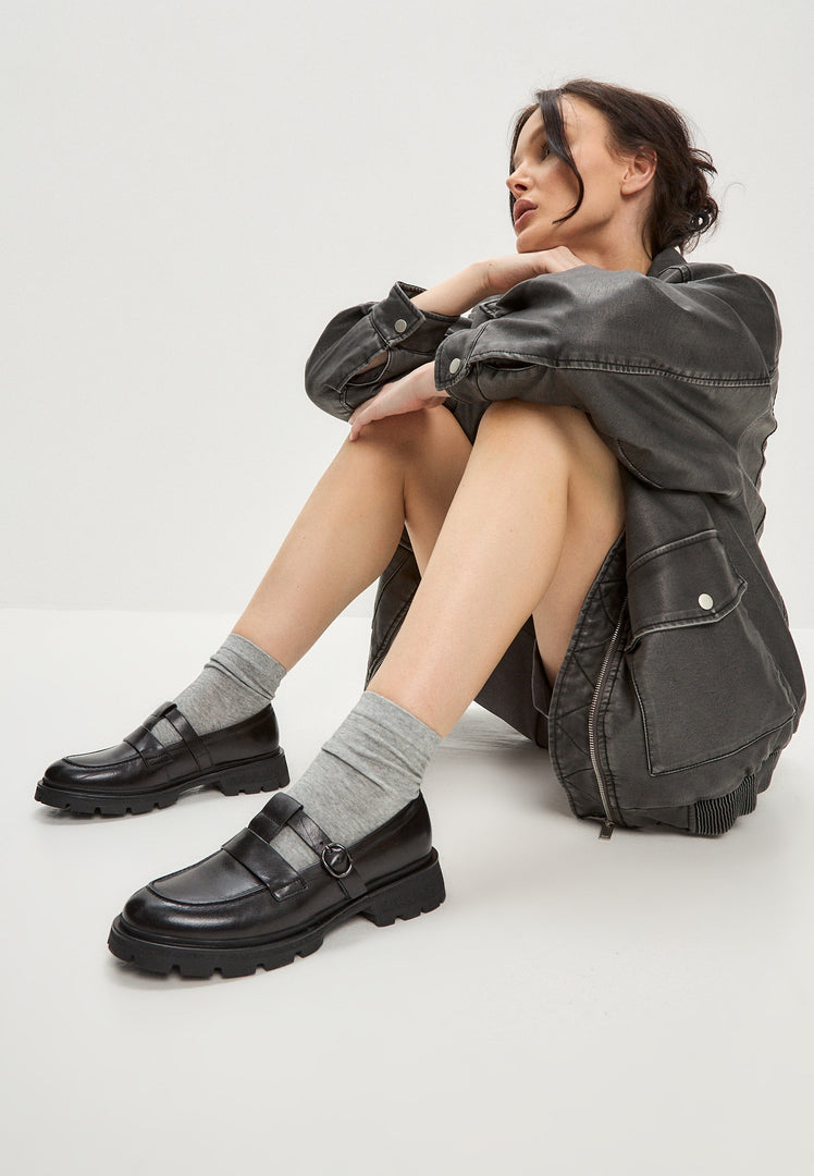 A stylish pair of women's platform loafers in leather, featuring the sleek design of Marina loafers, perfect for a trendy and comfortable look.