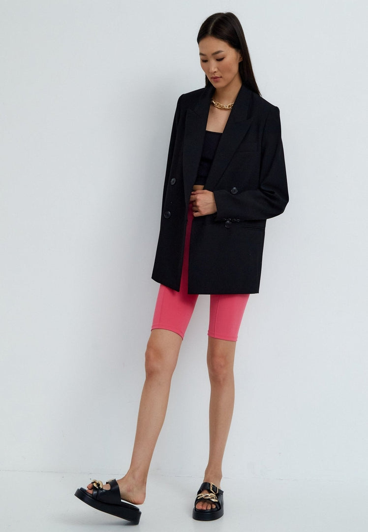 A close-up image of stylish black leather chain sandals, perfect for adding a touch of edgy elegance to any outfit.